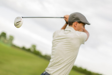 Young man playing golf