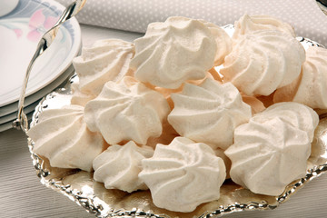 White meringue on a silver platter
