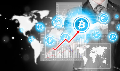 Choosing bitcoins, businessman pressing touch screen button.