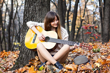 beautiful young woman in autumn park