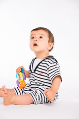 isolated studio portrait lovely toddler baby boy playing