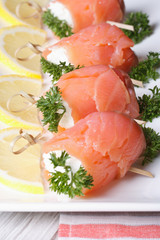 rolls with salmon, cream cheese and lemon closeup