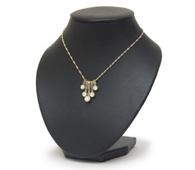 necklace on black mannequin isolated on white background