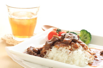  Homemade beef stew on rice with iced tea