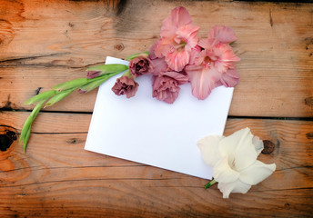 Blank paper with colorful flowers on the old background