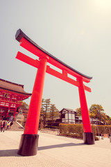 Red door named Torii in Fushimi Inari shrine, Kyoto, Japan in vi