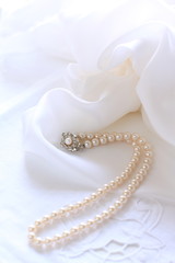pearl necklace on satin fabric for wedding image