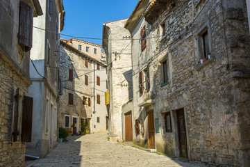 Fototapeta na wymiar Old and narrow street in Bale town, Istria, Croatia
