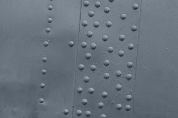 Riveted metal surface