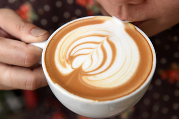 a cup of latte art coffee