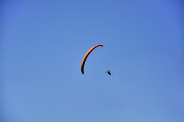 paragliding in the blue sky