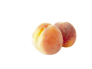 Two Ripe peaches  isolated over white