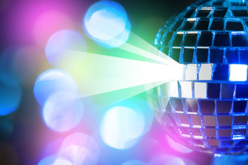 Blue shiny disco ball on Colorful bokeh background