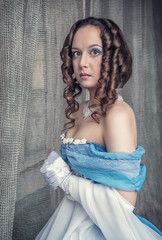 Beautiful medieval woman in blue dress