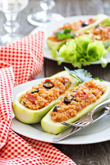 Stuffed squash with millet, tomatoes and olives