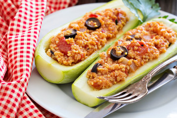 Stuffed squash with millet, tomatoes and olives