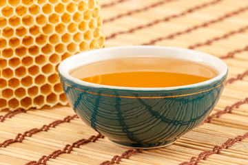 Honey in bowl with honeycomb