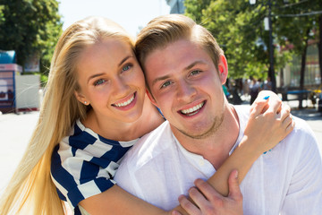 Portrait of a happy couple laughing at camera