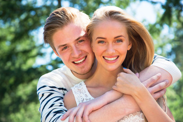 Portrait of a happy couple laughing at camera