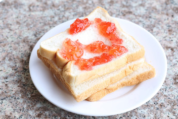 Bread with strawberry jam.