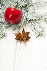 Christmas decoration with twigs, baubles, silver star and snow