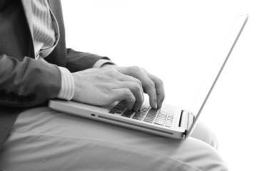 Businessman analyzing investment charts with laptop. Accounting