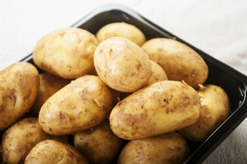 Fresh tasty new potatoes. Selective focus close up