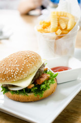 Closeup of home made burgers on table background