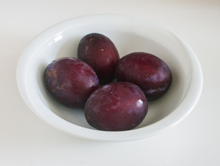 Red plum fruit isolated on white background