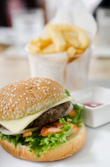 Closeup of home made burgers on table background