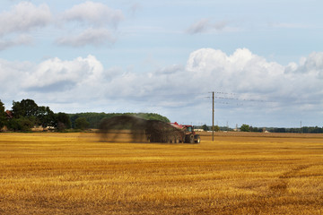 Fototapeta premium Tractor on the field.