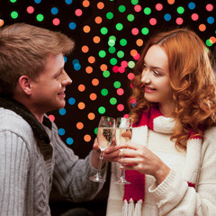 young happy smiling casual couple with wineglasses