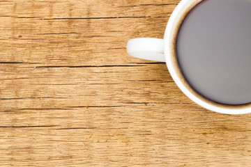 White ceramic coffee cup on wooden table