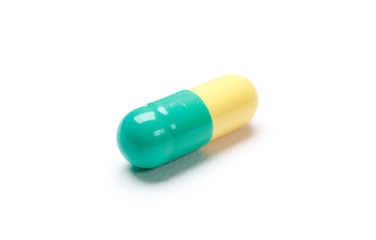 Green colored pill. Doctor's stuff. Prescription.