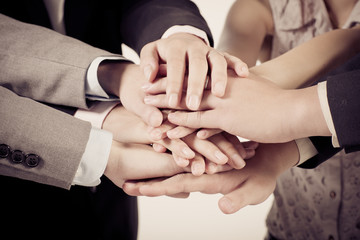 Business group with hands together - teamwork concepts