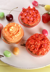 Tasty cupcakes on table, close up
