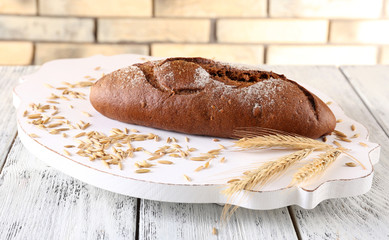 Fresh bread on wooden table, close up