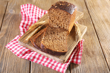 Fresh bread on wooden table, close up