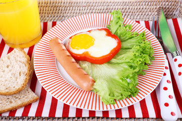 Scrambled eggs with sausage, lettuce and juice served on tray