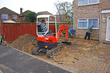 Fototapeta na wymiar Builders digging a drive in the UK