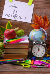 time for school concept with text on wooden background