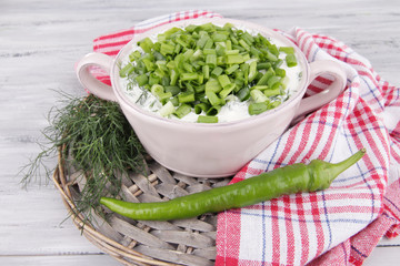 Pink round pan of cream with onion