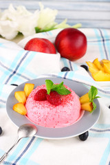 Heart shaped cake with fruits and berries on plate on