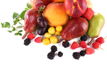 Different berries and fruits isolated on white