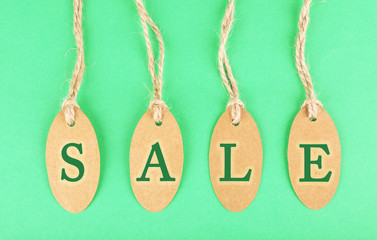 Sale tags on green background