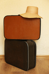 Vintage old travel suitcases on floor