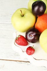 Ripe fruits and berries on table close up