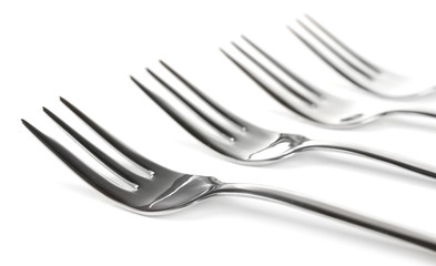Metal small dessert forks isolated on white