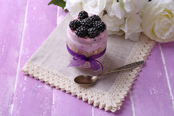 Obraz na płótnie Canvas Healthy breakfast - yogurt with blackberries and muesli served