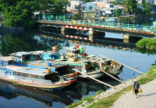 boat on polluted water of Vietnam canal